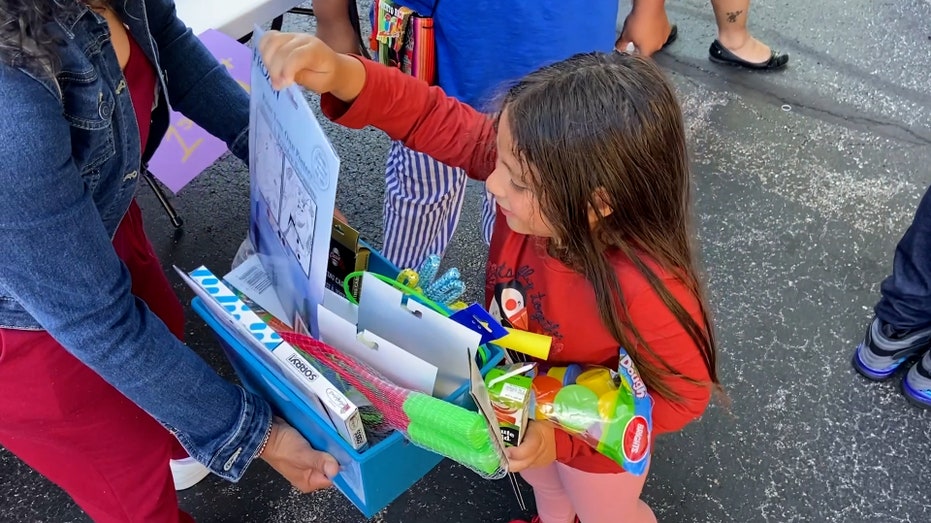 Student receives school supplies