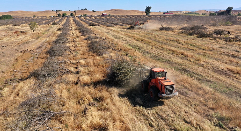 A tractor in a field impacted by drought