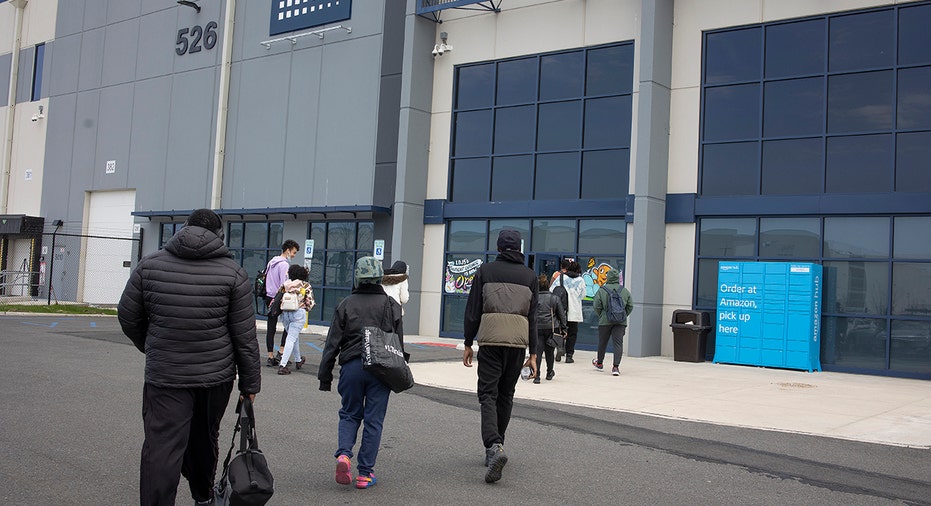 Warehouse workers entering the facility