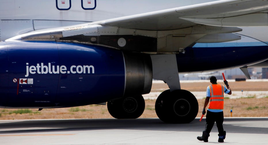 JetBlue ground crew directing aircraft