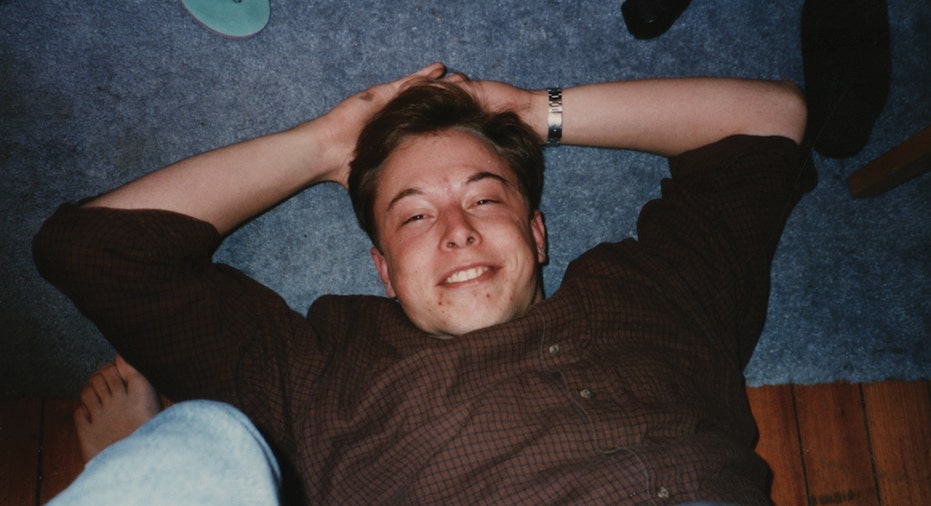 Elon Musk laying on floor of college dorm