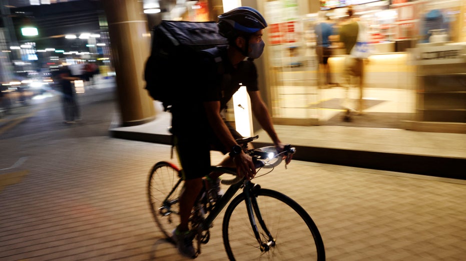 food delivery service worker on bicycle