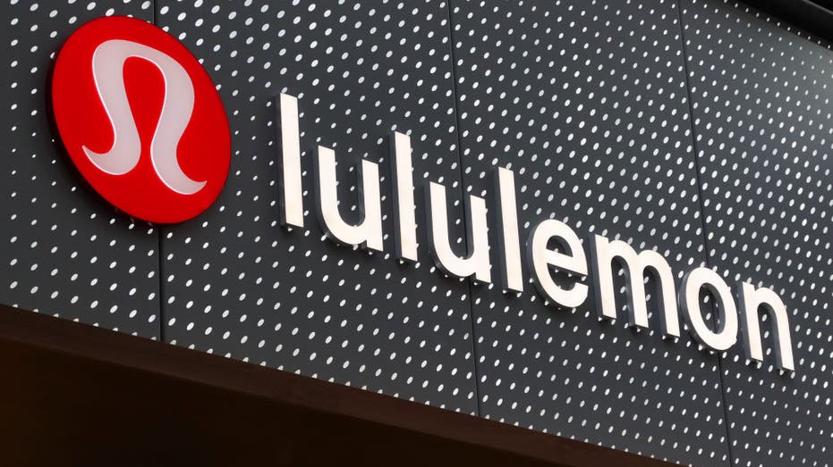 A Lululemon logo on a storefront