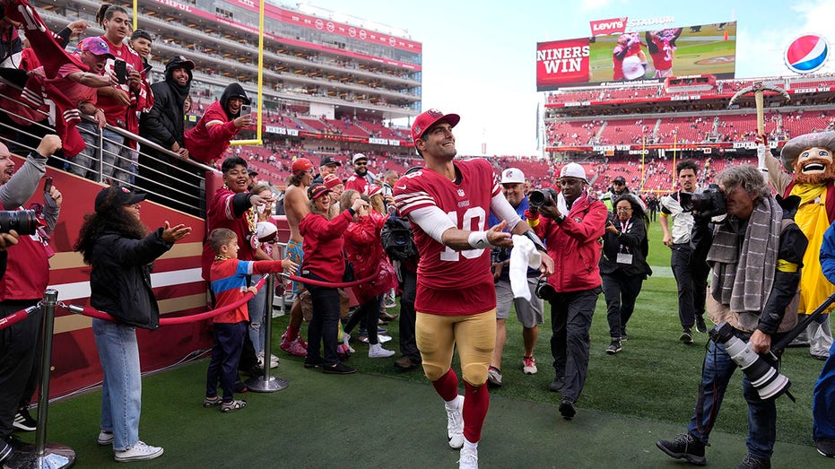 Jimmy Garoppolo tosses his towel to the fans