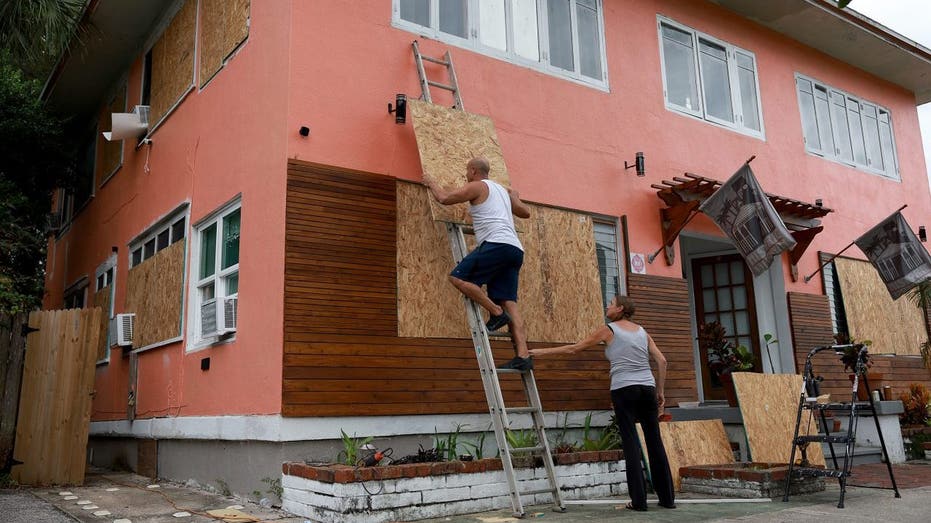 Florida residents boarding up windows