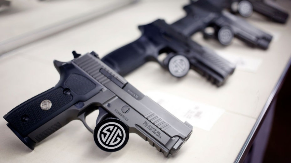 Display showing SIG Sauer pistols