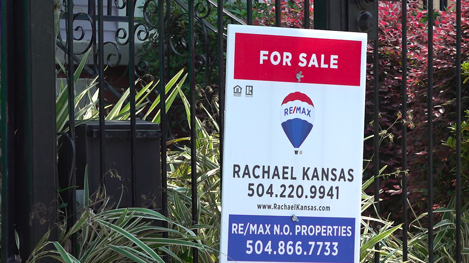 Close up shot of Remax for sale sign