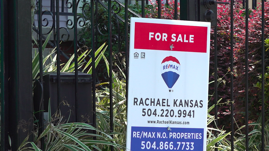 Close up shot of Remax for sale sign