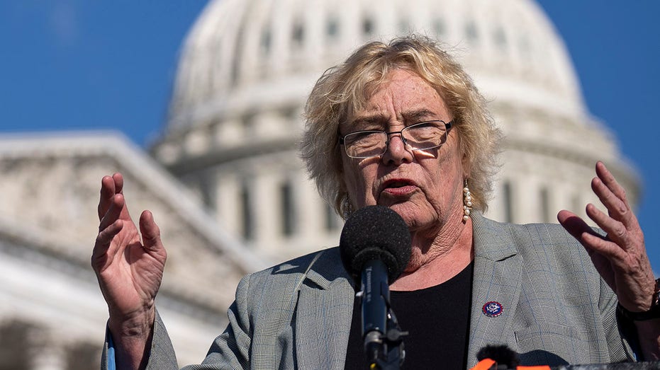 Rep. Zoe Lofgren (D-CA) with her hands raised