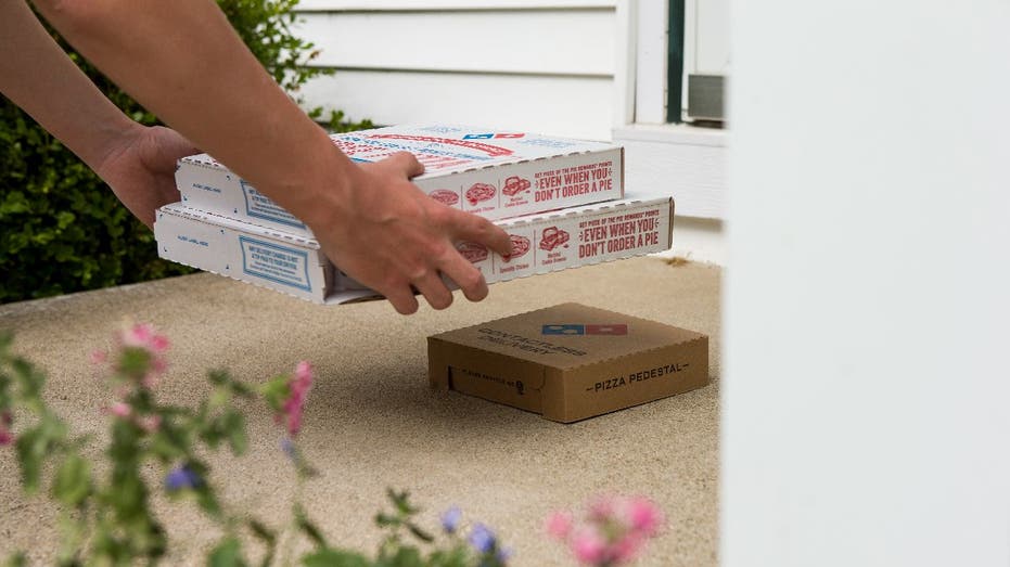 Domino's delivery person leaves boxes