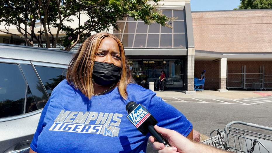 Woman in Memphis Tigers shirt