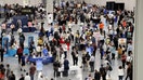 Job seekers visit booths during the Spring Job Fair at the Las Vegas Convention Center Friday, April 15, 2022. (K.M. Cannon/Las Vegas Review-Journal) @KMCannonPhoto