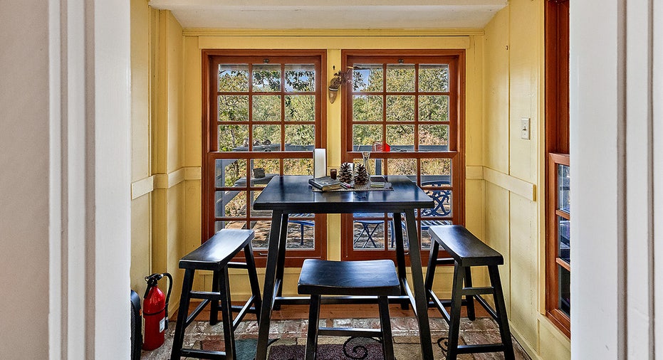 Rustic dining nook with black furniture