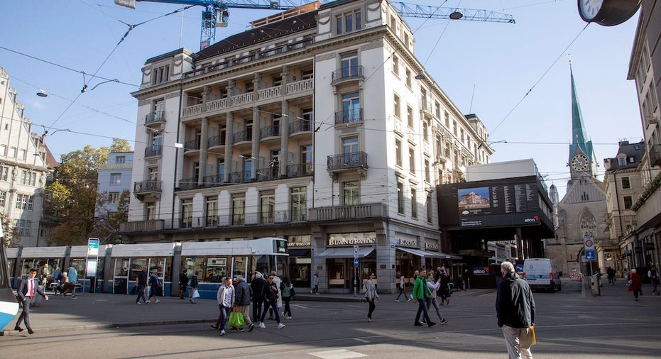 Credit Suisse to buy back $3B in debt, sell Hotel Savoy