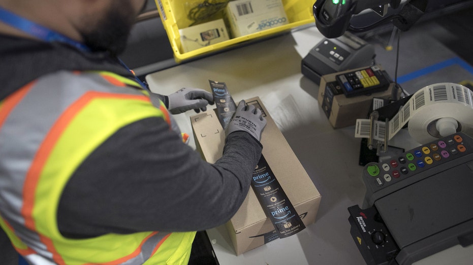 Amazon worker packing box