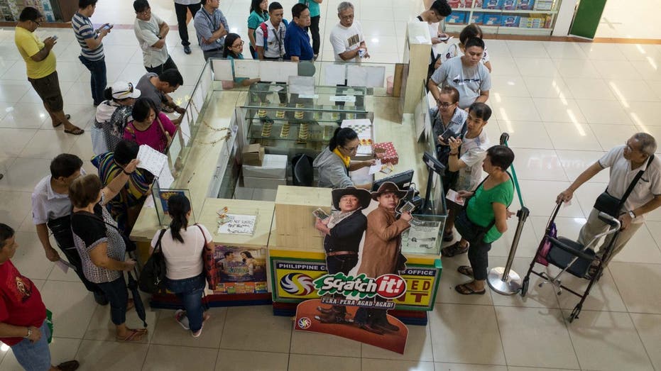 Philippine citizens buying lottery tickets