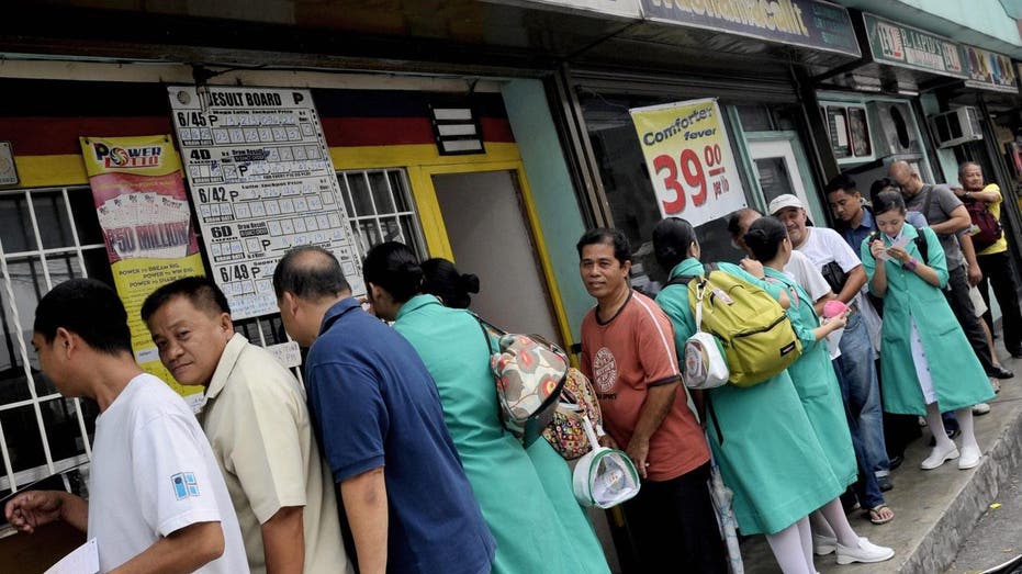 Philippine citizens buying lottery tickets