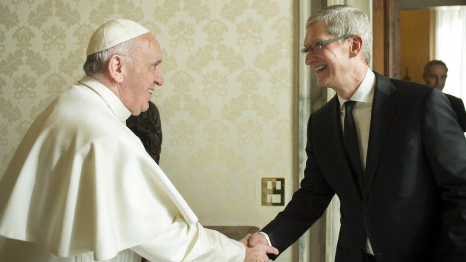 Pope shaking hands with Tim Cook