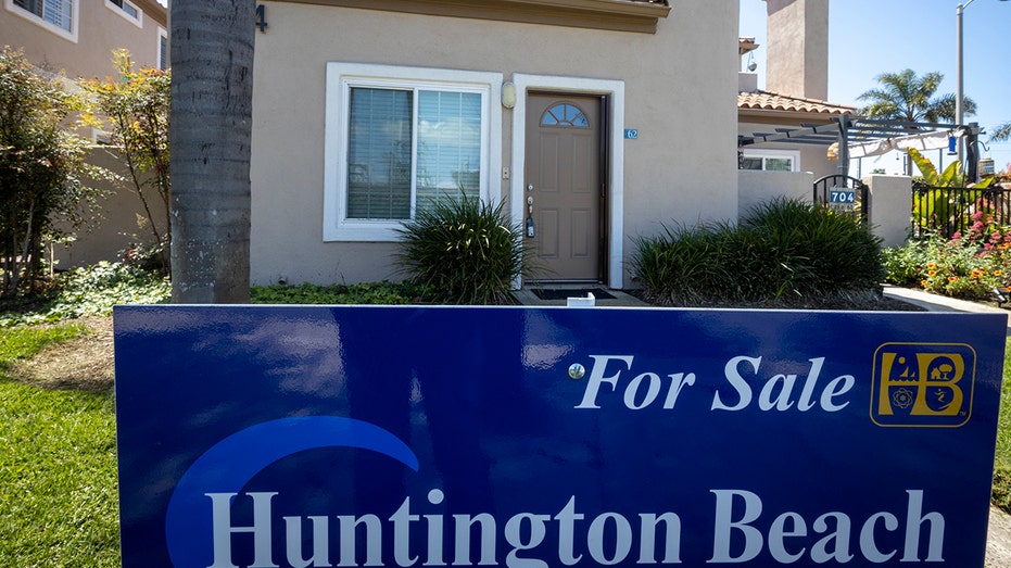 A for sale sign outside a home in Huntington Beach, California