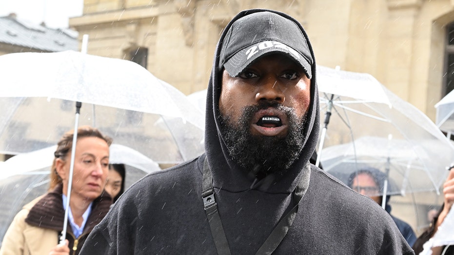 Kanye West with Balenciaga mouthguard