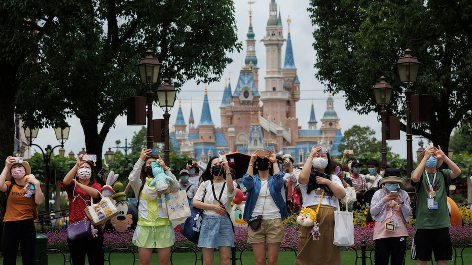 Shanghai Disneyland guests taking pictures