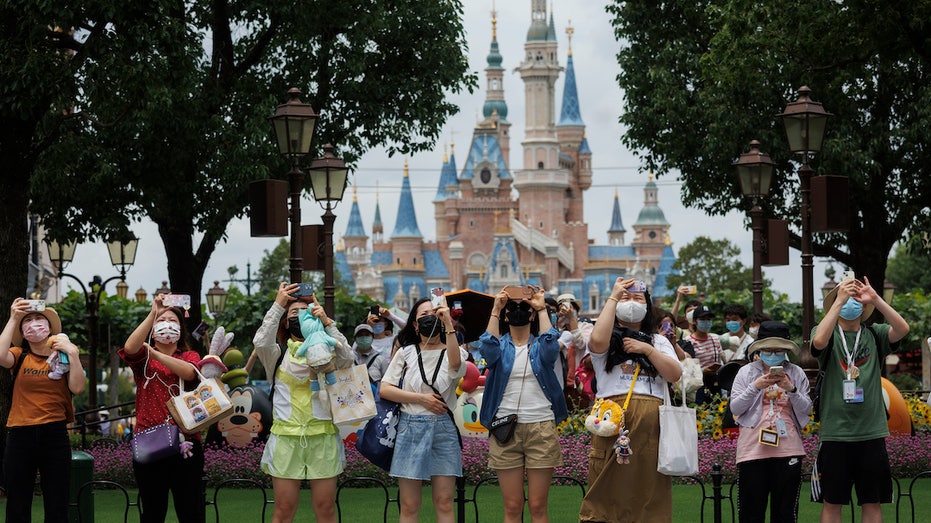 Shanghai Disneyland guests taking pictures