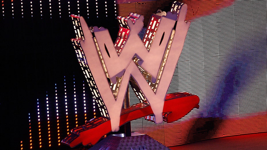 The WWE logo in an arena
