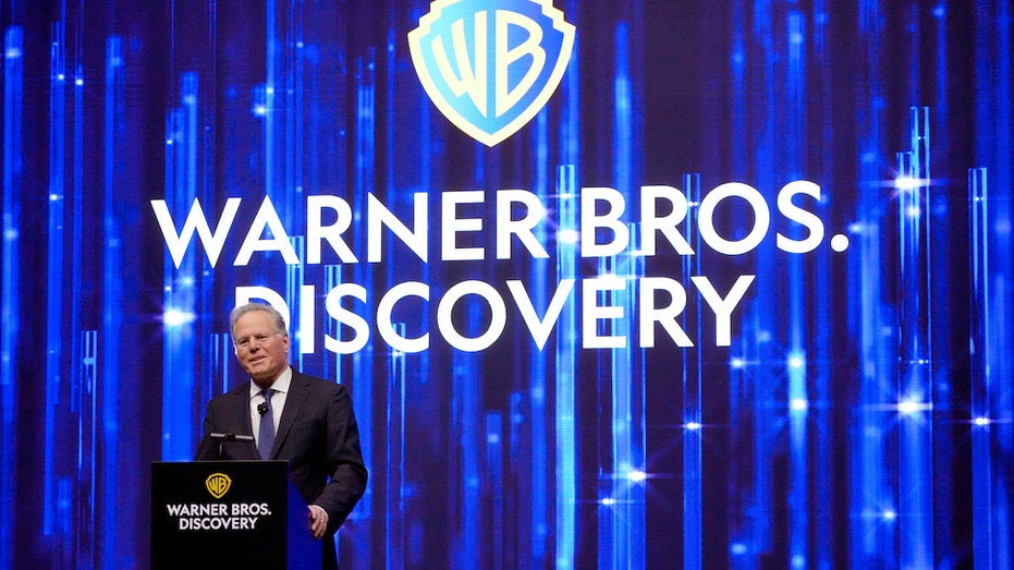 David Zaslav and Warner Bros Discovery logo