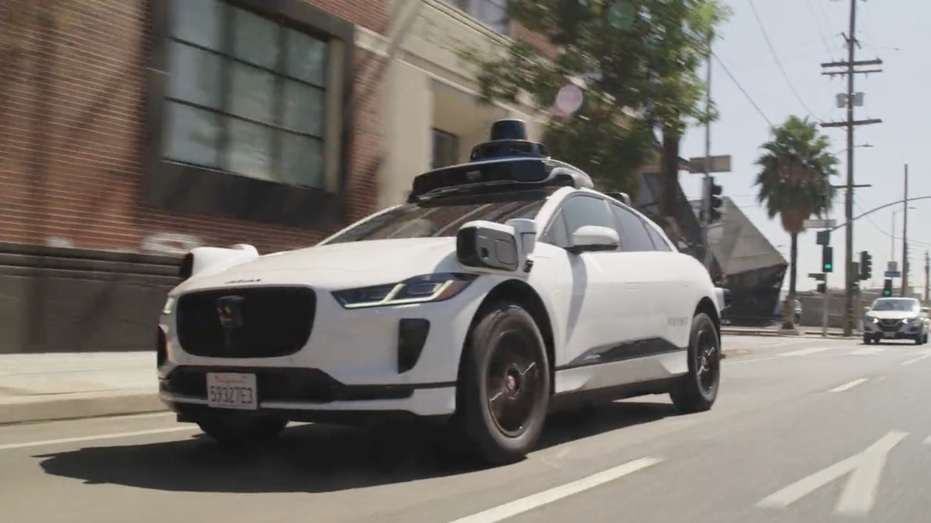 Autonomous Waymo vehicle on the road