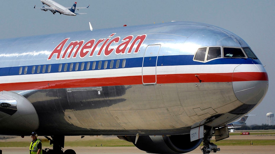 A silver, red, white and blue American Airlines plane