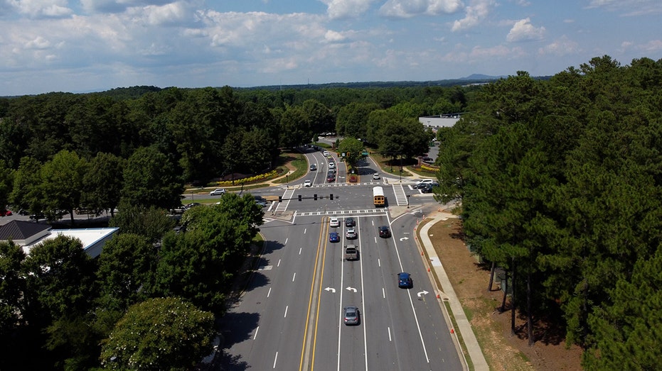 school bus driving through intersection