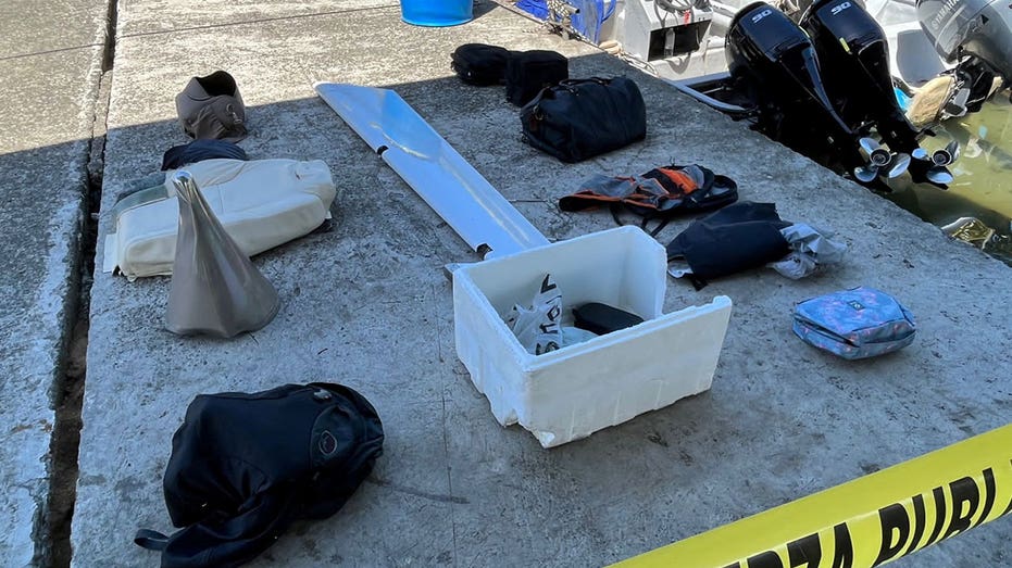 Personal belongings in boxes organized on cement floor