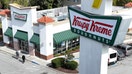 DALY CITY, CALIFORNIA - MAY 12: In an aerial view, a sign is posted in front of a Krispy Kreme doughnut store on May 12, 2022 in Daly City, California. Krispy Kreme reported strong first quarter earnings with net income of $4 million compared with a loss of $3.06 million one year ago. 