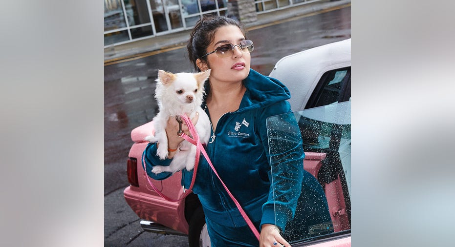 woman and dog in juicy couture