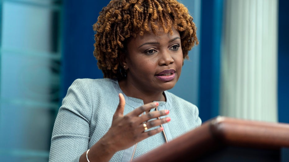 White House Press Secretary Karine Jean-Pierre speaks at a podium