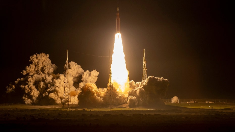 The Space Launch System rocket lifts off