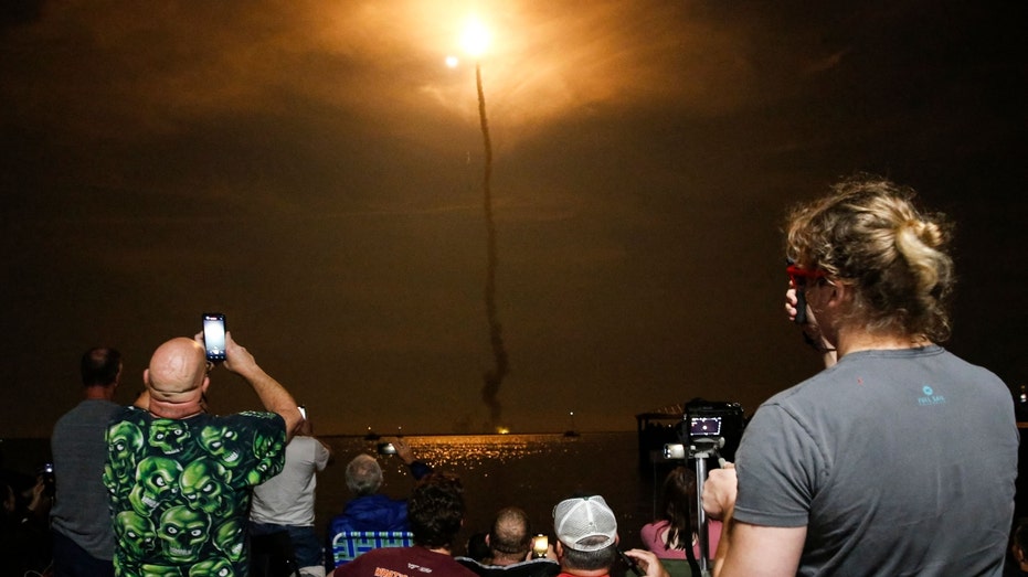 People at Veterans Memorial park watch as the Artemis I launch