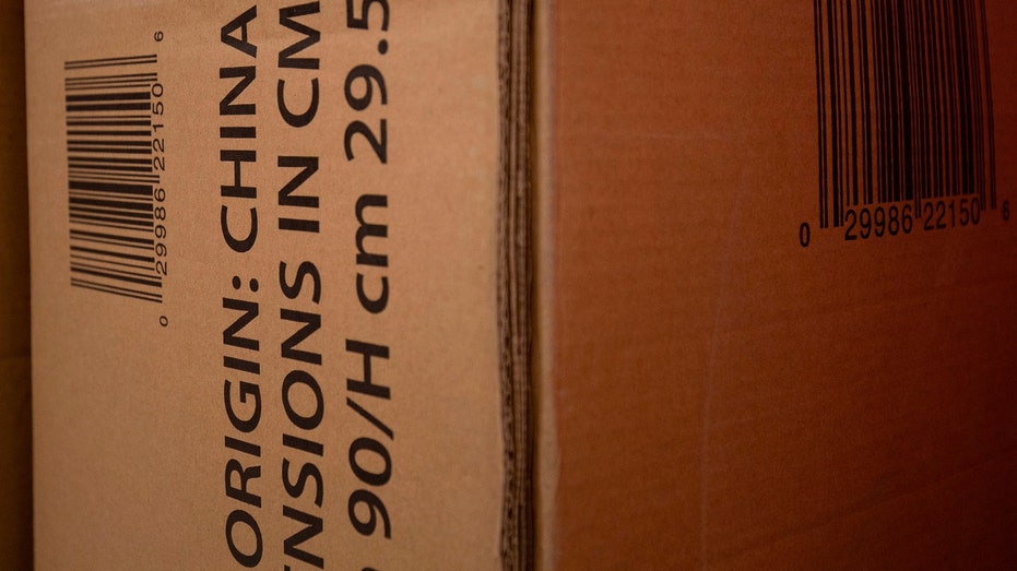 A cardboard box containing a sofa