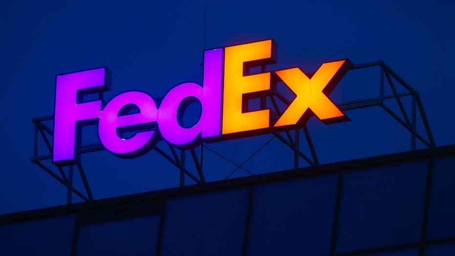 FedEx lighted sign atop building