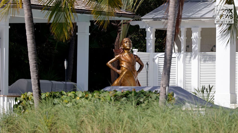 Fearless Girl statue overlooking the Atlantic Ocean