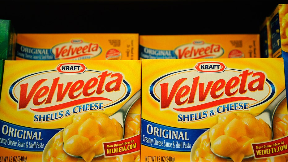 Velveeta Shells and Cheese sit on a store shelf