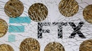 An FTX logo and a representation of cryptocurrencies are seen through broken glass in this illustration taken December 13, 2022. REUTERS/Dado Ruvic/Illustration