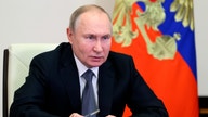 Putin accuses West of 'robbery' through sanctions in national speech on flagging economy