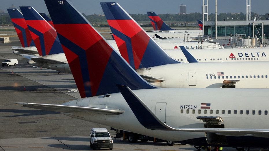 Several Delta Air Lines planes on a tarmac