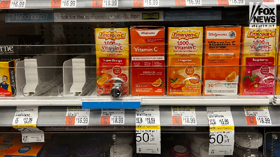 Vitamin C boxes locked behind plastic in shop