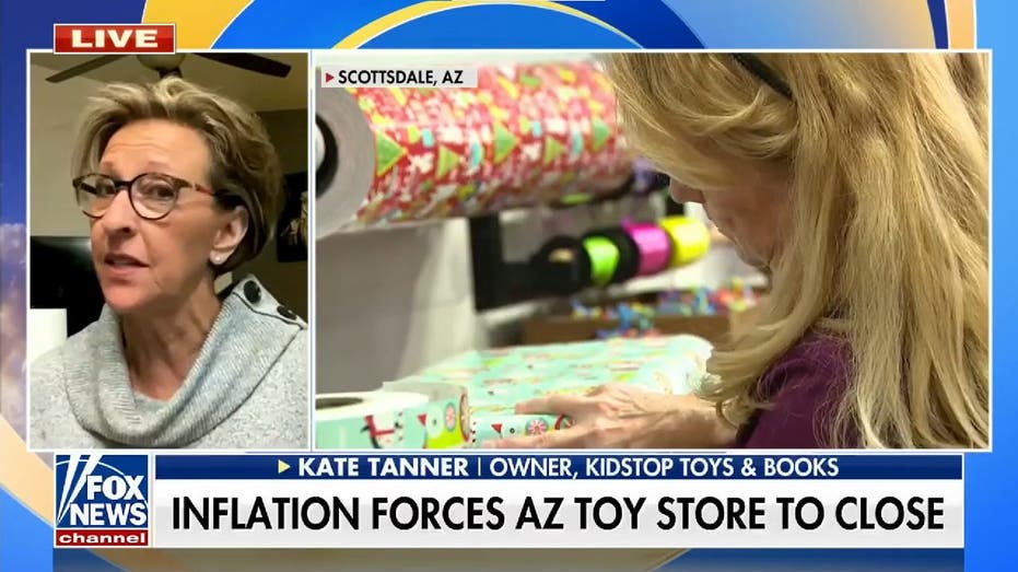 Kidstop Toys & Books Owner Kate Tanner next to worker wrapping gifts.