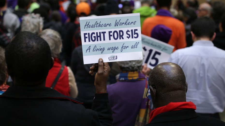 A National Day of Action 15 dollar per hour minimum wage protest at the Massachusetts State House in Boston