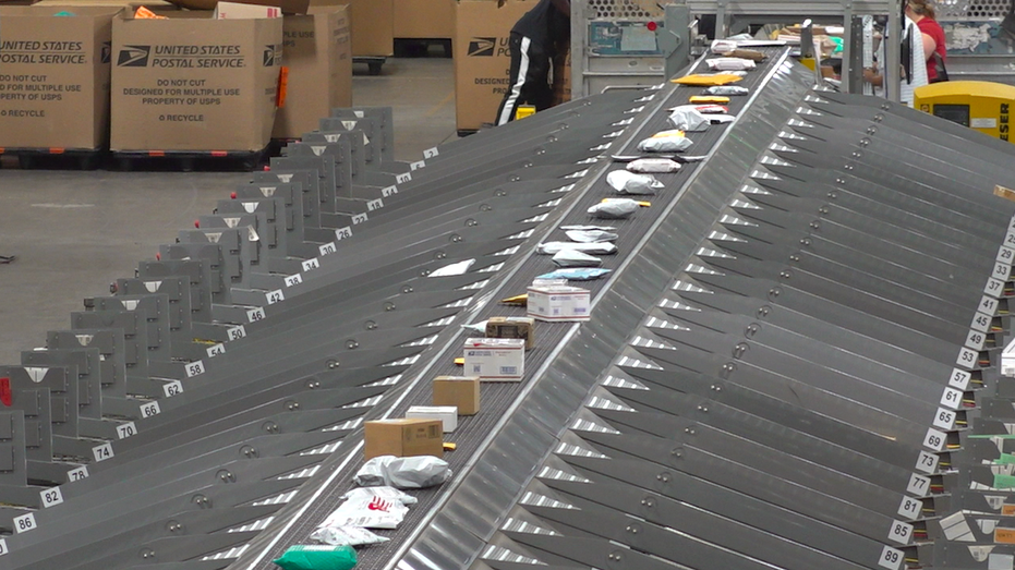 Long conveyor belt with packages on it