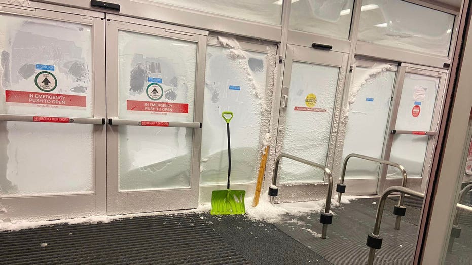 Photo of the front doors of Target frozen shut.