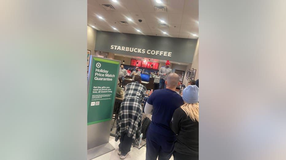 Shoppers waiting at the Starbucks section of Target.